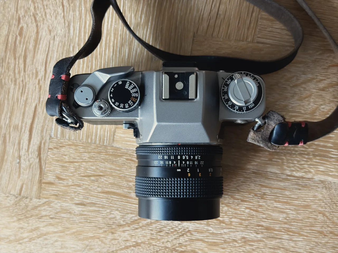 Top-down view of the Contax S2 showing the shutter speed dial, hot shoe and ISO dial, with a Zeiss lens fitted