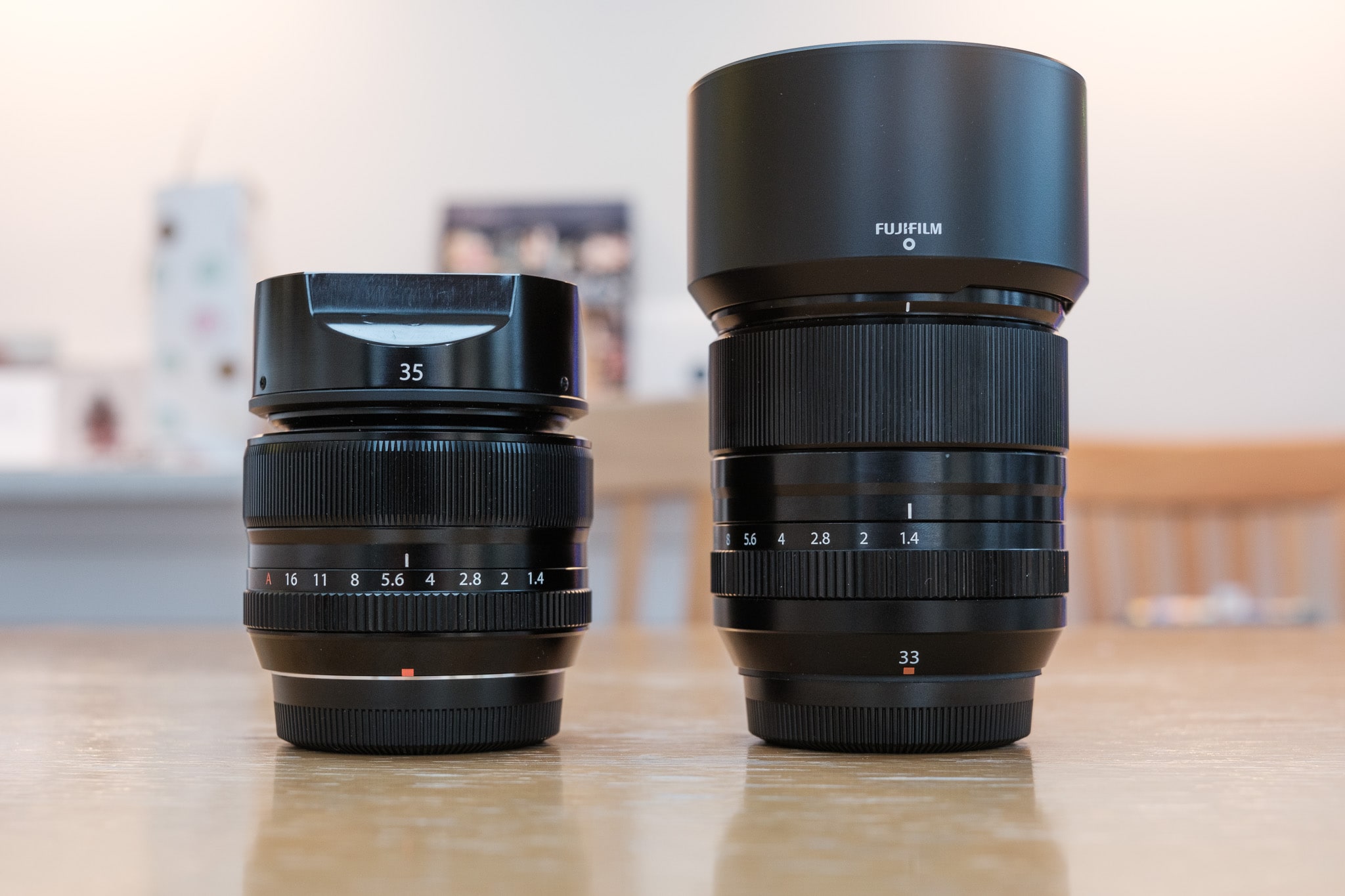 35mm f1.4 and 33mm f1.4 side by side with lens hoods on