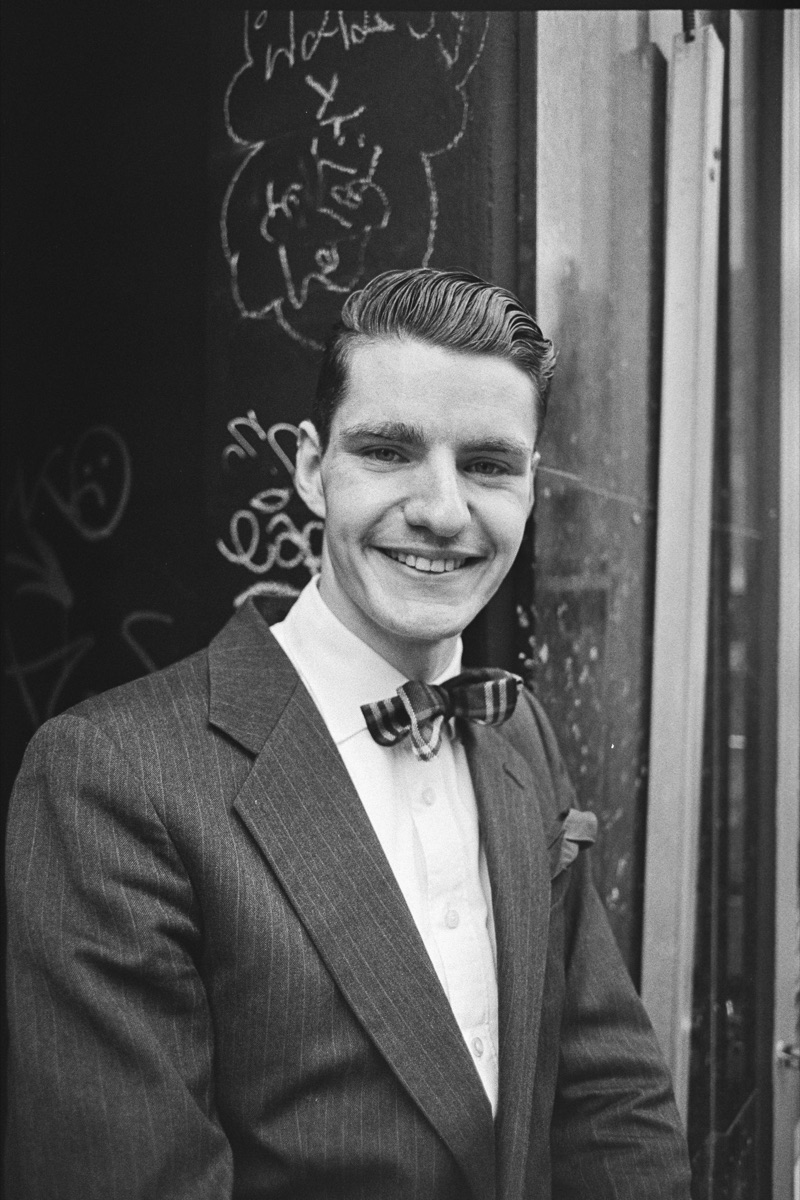 Young man in a suit and bow tie