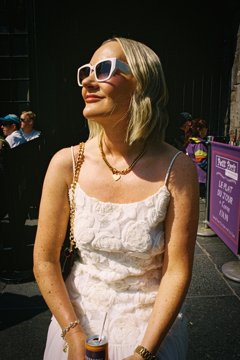 Woman in a white dress and sunglasses